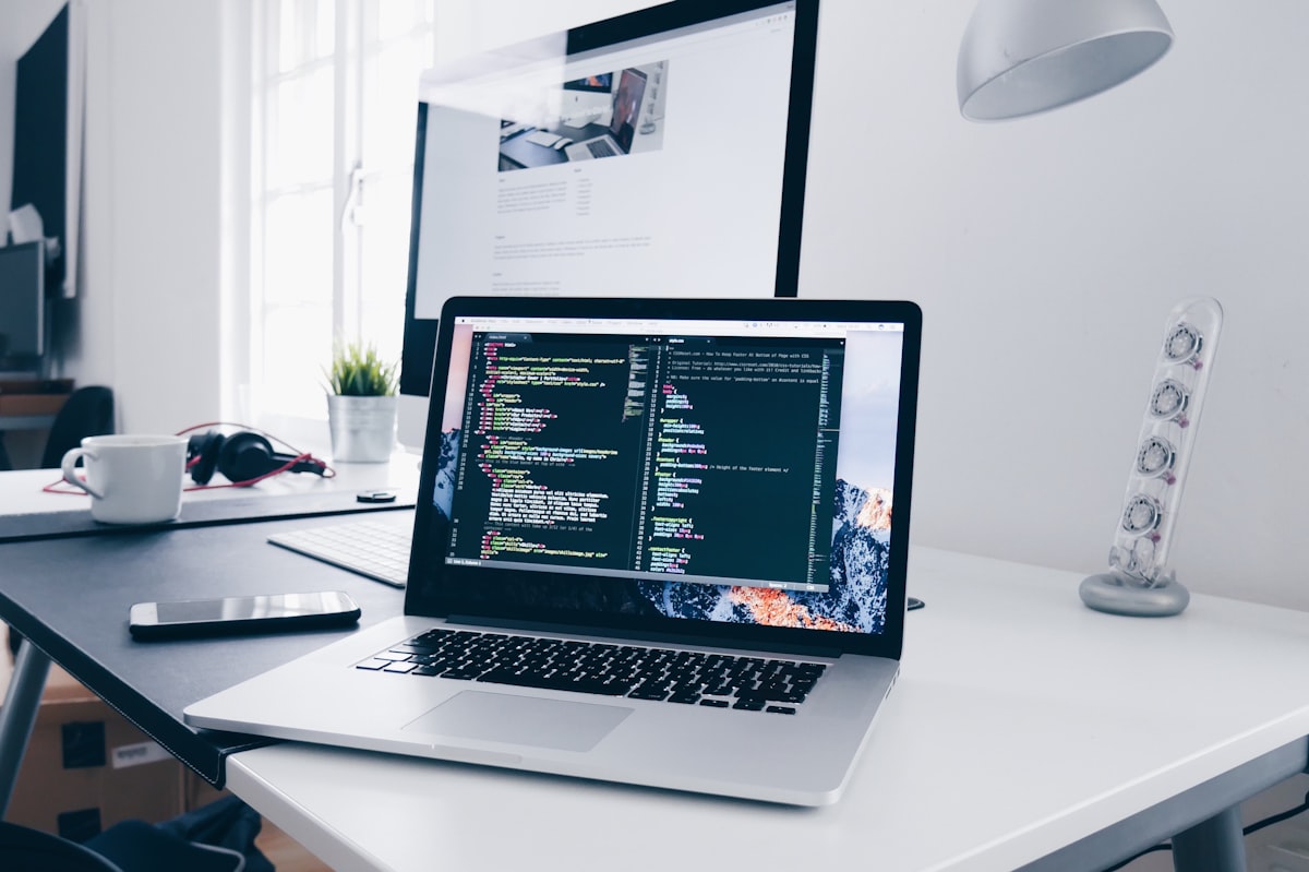 Modern web development workspace with code on screen